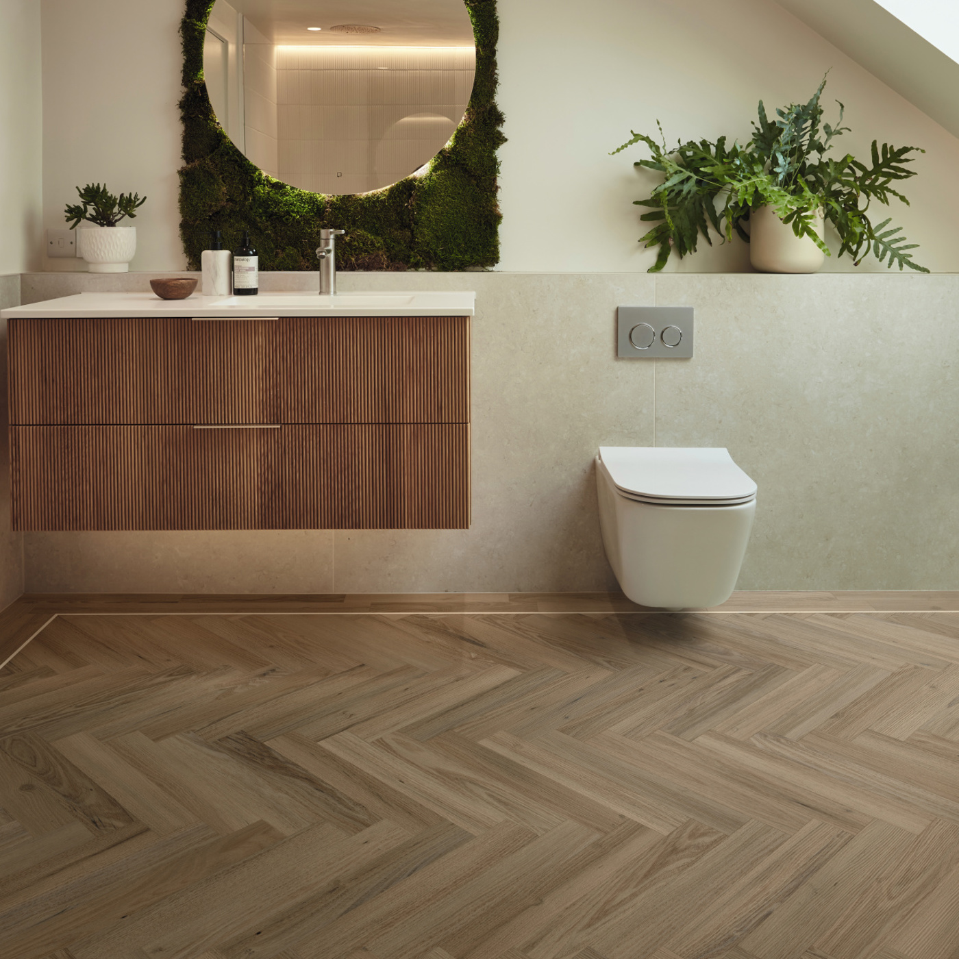 Duxbury Acacia herringbone wood LVT flooring in a bathroom