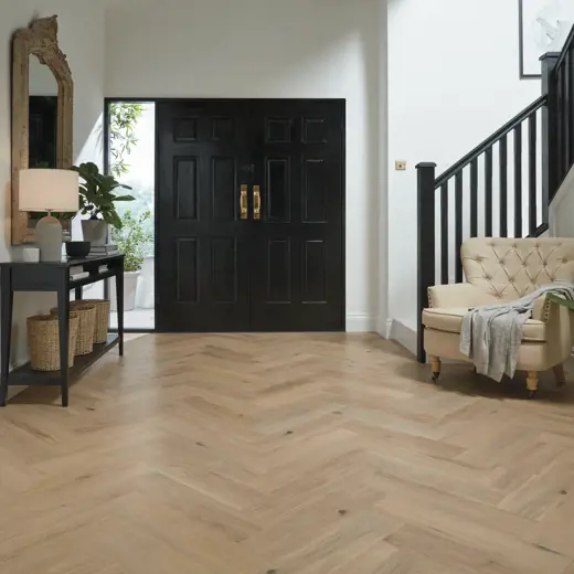 Van Gogh Canadian Urban Oak mid brown LVT herringbone laid in a hallway
